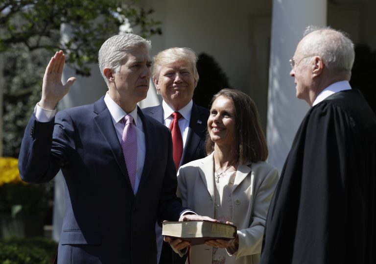 President Trump had a poor rate of Senate confirmations, but did get Neil Gorsuch confirmed to the U.S. Supreme Court. Here Trump watches as Supreme Court Justice Anthony Kennedy administers the judicial oath to Gorsuch in May. (AP Photo/Evan Vucci)