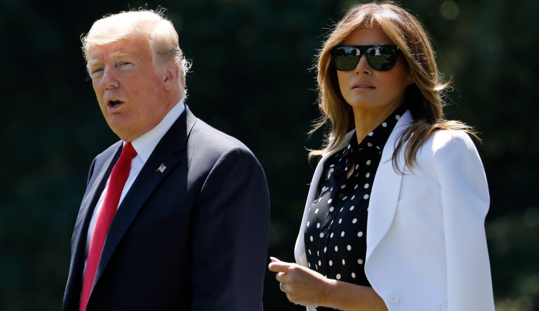 President Trump and first lady Melania Trump walk towards Marine One.