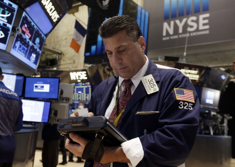 Trader William McInerney works on the floor of the New York Stock Exchange Tuesday, July 1, 2014. The stock market rose in early trading after a report showed that manufacturing in the US and China expanded in June, boosting the outlook for global growth. (AP Photo/Richard Drew)