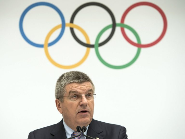 FILE - This is a Monday, July 7, 2014  file photo of International Olympic Committee, IOC, President Thomas Bach of Germany, as speaks during the announcement of the 2022 Olympic Winter Games Candidate Cities (Beijing 2022, Oslo 2022, Almaty 2022) after an executive board meeting, at the IOC headquarters in Lausanne, Switzerland. The IOC will not reopen the bidding process for the 2022 Winter Games after Oslo's withdrawal left just two cities in the race, IOC President Thomas Bach told The Associated Press on Thursday Oct. 2, 2014. (AP Photo/Keystone,Jean-Christophe Bott, File)