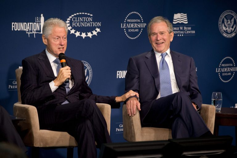 Former Presidents Bill Clinton, left, and George W. Bush, speak at the Presidential Leadership Scholars Program Launch at The Newseum, Monday, Sept. 8, 2014, in Washington. (AP Photo/Jacquelyn Martin)