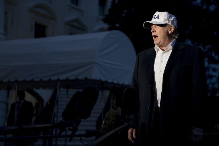 President Donald Trump speaks to members of the media on the South Lawn at the White House in Washington, Sunday, Dec. 17, 2017, as he returns from Camp David in Maryland. (AP Photo/Andrew Harnik)