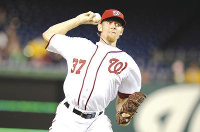 Greg Fiume/Getty Images
Stephen Strasburg threw 56 pitches, including 40 strikes, through five innings in his return to the Nats after a 12-month hiatus.