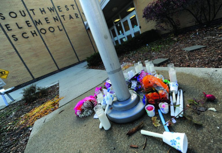 A memorial is set up outside Southwest Elementary school in Greenwood, Ind., Monday Nov. 12, 2012 for victims of the explsion in Indianapolis. The coroner's office had not yet identified the two people killed in the blast, but a candlelight vigil was held Sunday at the school where Jennifer Longworth teaches. (AP Photo/The Daily Journal,Scott Roberson)