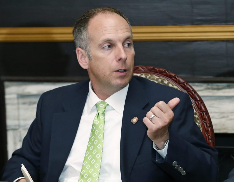 Oklahoma state House Speaker Jeff Hickman, R-Fairview, gestures during a news conference to announce an agreement on the budget, in Oklahoma City, Friday, May 16, 2014. Oklahoma Gov. Mary Fallin and legislative leaders announced a budget agreement Friday for the upcoming year that is $102 million less than the budget for the current year, but still increases funding for public schools by $80 million. (AP Photo/Sue Ogrocki)