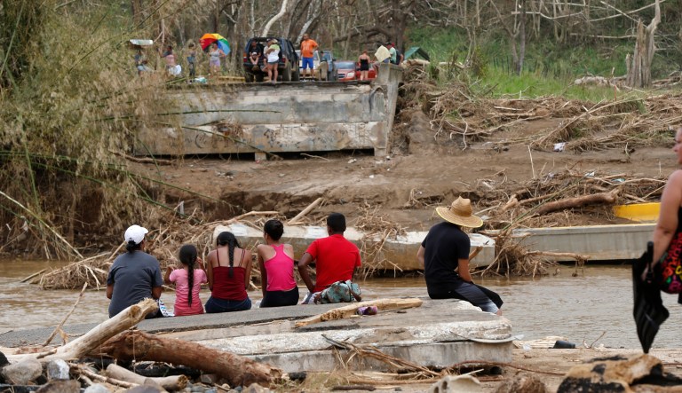 The Federal Emergency Management Agency just approved the city's request for a $3 million grant to build the Civic Center Commons park. As 3.4 million Puerto Ricans (like those pictured above) struggle to find safe drinking water, FEMA announced on Friday that they'd help turn a parking lot in downtown Cheyenne, Wyo. into a drainage pond. (AP Photo/Gerald Herbert)