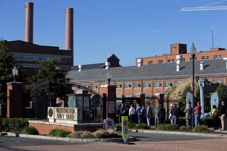 A new report says contract guards who protect federal facilities are receiving uneven training on responding to shootings like the one last month at the Washington Navy Yard. (AP/Jacquelyn Martin)