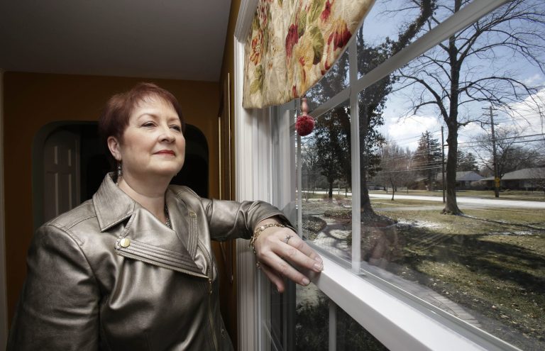 In this Wednesday, March 26, 2014 photo, Heather Britton poses for a photo at her home in Bay Village, Ohio. New research is boosting hopes that weight-loss surgery can put some patients' diabetes into remission for years and perhaps in some cases, for good. Some patients, like Britton, have passed the five-year mark when some experts consider cure or prolonged remission a possibility. Before the study, she was taking drugs for diabetes, high blood pressure and high cholesterol; she takes none now. (AP Photo/Tony Dejak)