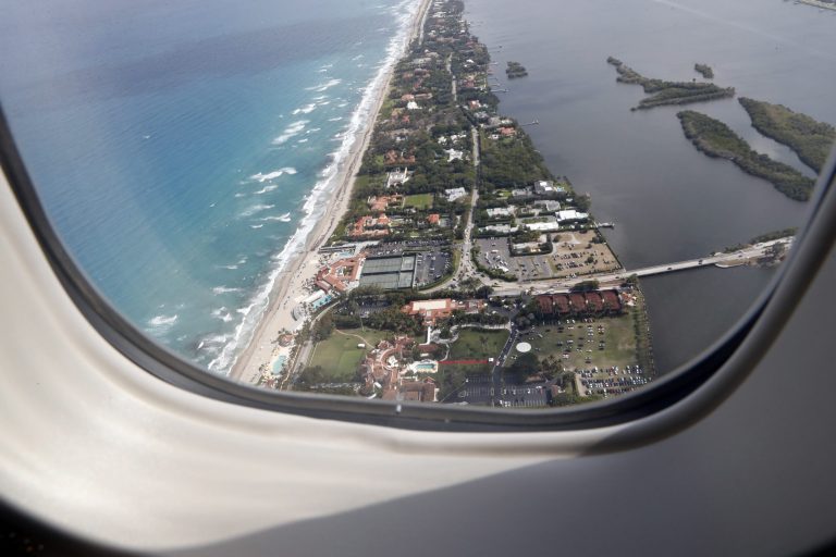 The Mar-a-Lago resort in Palm Beach, Fla., is seen from the window of Air Force One while in flight from Palm Beach International Airport, in West Palm Beach, Fla., to Andrews Air Force Base, Md., Sunday, April 16, 2017. (AP Photo/Alex Brandon)