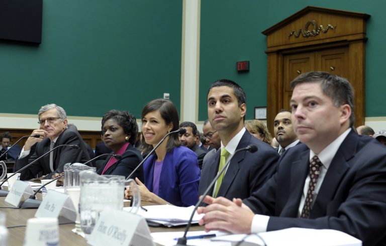 Republican FCC commissioner Michael O'Rielly, right, pictured here at a hearing with the rest of the commission on Capitol Hill in Washington on Dec. 12, was very critical of the CIN study. (AP Photo/Susan Walsh)