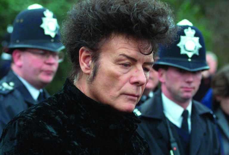 FILE - In this Jan, 11, 2000 file photo, British performer Gary Glitter, during a press conference in London. Police investigating the sex abuse scandal surrounding late BBC children's television host Jimmy Savile have arrested pop star Gary Glitter in connection with the case, British media said Sunday, Oct. 28, 2012. Metropolitan Police said they arrested a man in his 60s early Sunday morning at his London home, on suspicion of sexual offenses, and that he remains in custody in a London police station. (AP Photo/Alastair Grant, File)