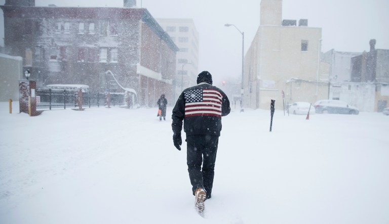 A man pushes his way through a winter snowstorm in Atlantic City, N.J., Thursday, Jan. 4, 2018. A massive winter storm swept from the Carolinas to Maine on Thursday, dumping snow along the coast and bringing strong winds that will usher in possible record-breaking cold. (AP Photo/Matt Rourke)