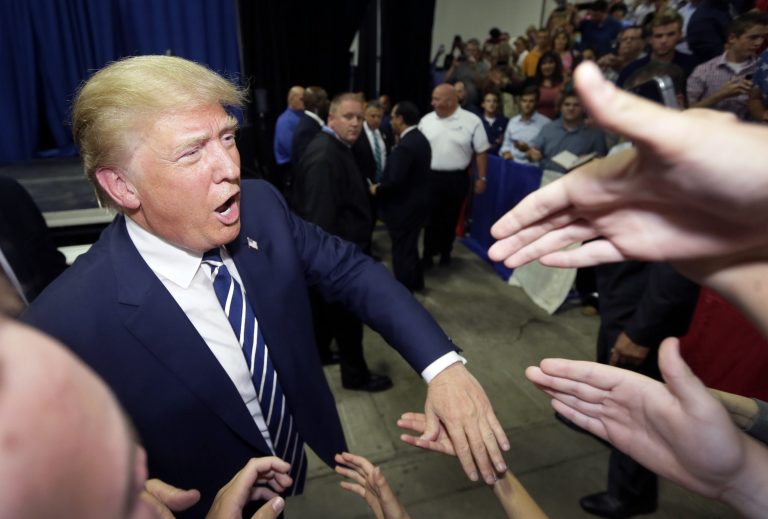 Republican presidential candidate Donald Trump meets supporters after addressing a GOP fundraising event, Tuesday, Aug. 11, 2015, in Birch Run, Mich. (AP Photo/Carlos Osorio)