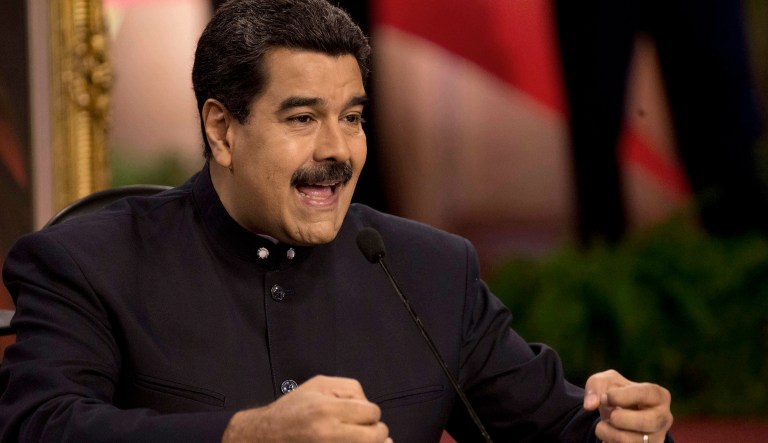 Trump's order prohibits the sale of Venezuelan government debt and related revenue streams for the Venezuelan government. (AP Photo/Ariana Cubillos)