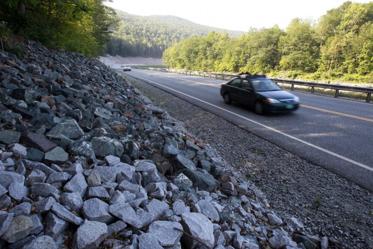   In this Aug. 22, 2013 photo, cars travel on the rebuilt Vermont Route 107 in Bethel, Vt. In what some consider a bit of an engineering marvel, a three-mile section of Route 107 between Bethel and Stockbridge, a major east-west highway that was destroyed by the storm, was rebuilt and reopened in 119 days, a job that normally would have taken two years. Driving in America has stalled, leading researchers to ask: Is the national love affair with the automobile over? After rising for decades, total vehicle use in the U.S. peaked in August 2007. It then dropped sharply during the Great Recession and has largely plateaued since. (AP Photo/Toby Talbot)  