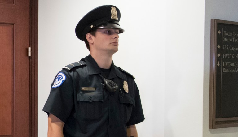 Capitol Police escorted the protesters out. (AP Photo/J. Scott Applewhite)