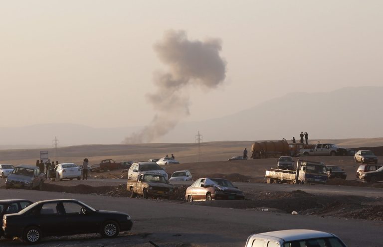 Smoke rises after airstrikes by the U.S. forces targeting Islamic State militants near the Khazer checkpoint outside of the city of Irbil in northern Iraq, Friday, Aug. 8, 2014. The airstrikes by the U.S. forces were launched outside the Kurdish regional capital Irbil, and marked the first time U.S. forces have directly targeted the extremist Islamic State group, which controls large areas of Syria and Iraq. (AP Photo/ Khalid Mohammed)