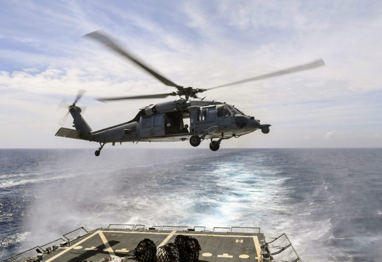 An MH-60S Sea Hawk helicopter hovers over the destroyer USS Wayne E. Meyer in the South China Sea on Feb. 24. (Navy photo)