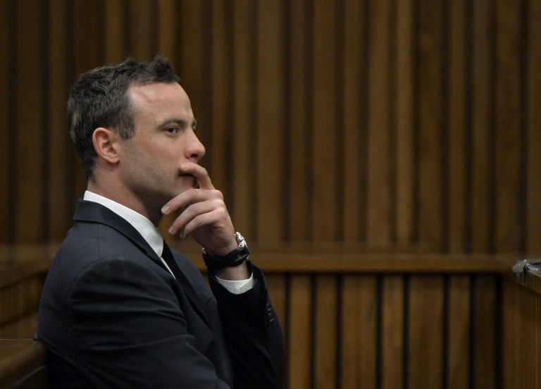 Oscar Pistorius gestures, as he sits in court in Pretoria, South Africa, Thursday, July 3, 2014, at his ongoing murder trial. Pistorius is a 