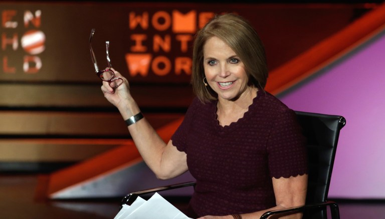 Katie Couric said her team also witnessed opposing demonstrators throw feces at one another. (AP Photo/Richard Drew)