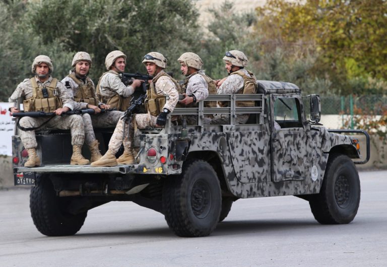 In this Wednesday, Dec. 3, 2014 file photo, Lebanese army special forces patrol near the area where militants ambushed Lebanese soldiers, in Ras Baalbek town, eastern Lebanon. (AP Photo/Hussein Malla, File)