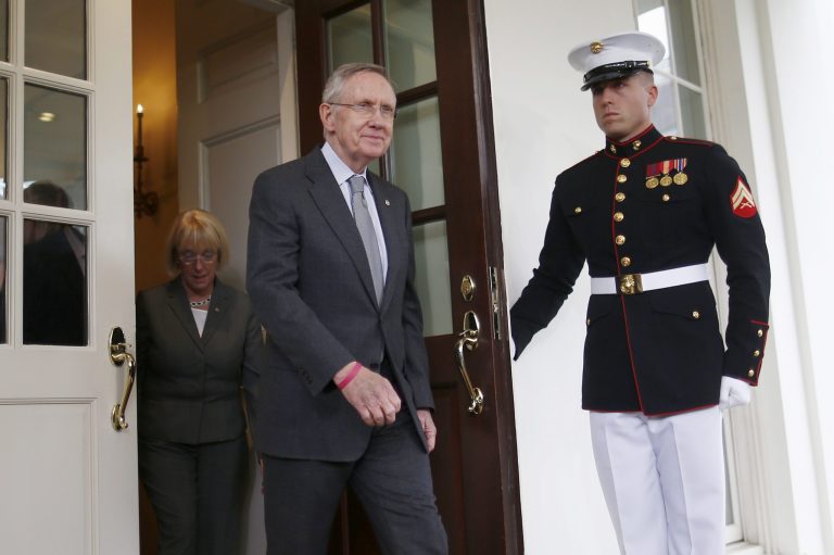 A Marine honor guard holds open the door to the West Wing of the White House in Washington, Thursday, Oct. 10,2013, as Senate Majority Leader Harry Reid of Nev. and Senate Appropriations Committee Chair Sen. Patty Murray, D-Wash., walk out to talk to reporters following a meeting with President Barack Obama regarding the government shutdown and debt ceiling. (AP Photo/Charles Dharapak)