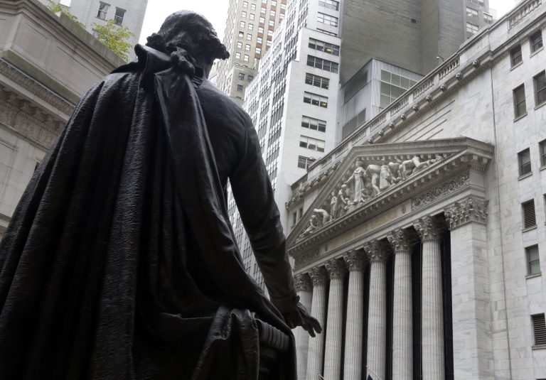 In this Oct. 2, 2014 photo, the statue of George Washington on the steps of Federal Hall faces the facade of the New York Stock Exchange, in New York. U.S. stocks opened higher Monday, Oct. 6, 2014, as investors assessed corporate news.