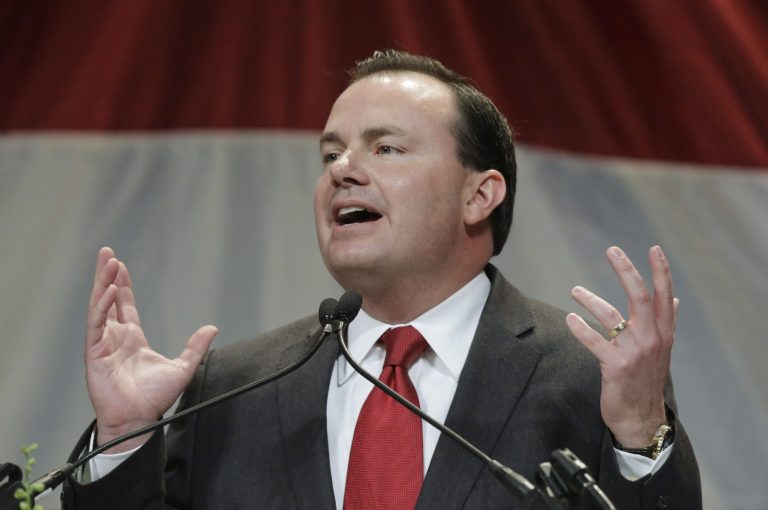 FILE - This May 18, 2013, file photo, Utah Republican Sen. Mike Lee addresses the Utah Republican Party's annual organizing convention in Sandy, Utah. . Lee says he won't support the current immigration bill in the Senate. The Salt Lake Tribune reports that Lee says the bill isn't tough enough on people who've violated immigration laws. (AP Photo/Rick Bowmer, File)
