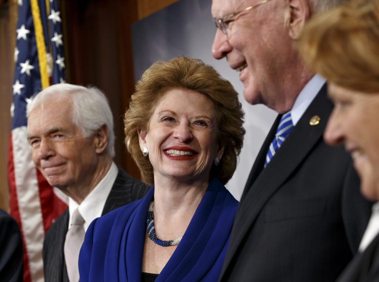 Senate Agriculture Committee Chair Sen. Debbie Stabenow, D-Mich., second from left, celebrates with fellow committee members on Capitol Hill on Tuesday after Congress gave its final approval to a sweeping five-yearÃÂ farmÃÂ bill. (AP/J. Scott Applewhite)