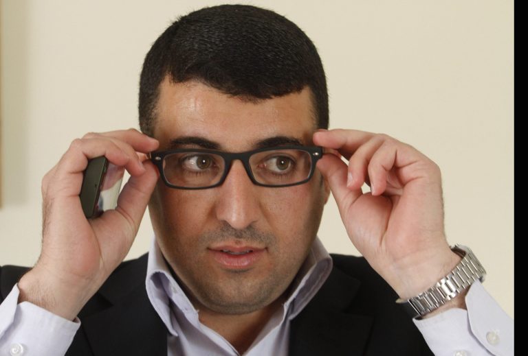 In this Saturday, 30 March, 2013 photo, Palestinian journalist Mamdooh Hamamreh adjusts his glasses during an interview to the Associated Press in the West Bank village of Hussan, near Bethlehem. Last week an appeals court in the West Bank upheld a one-year prison term for Mamdooh Hamamreh for 