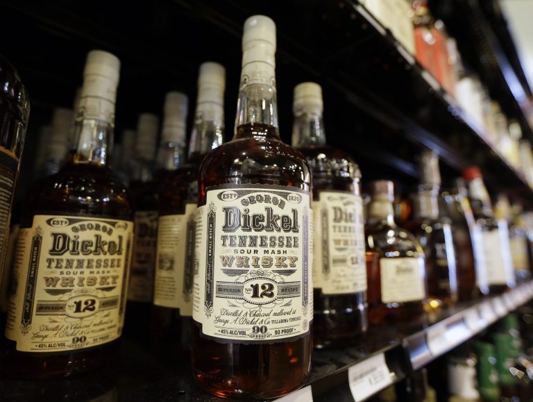 Bottles of George Dickel Tennessee whiskey are displayed in a liquor store Tuesday, June 10, 2014, in Nashville, Tenn. Alcohol regulators ended their investigation into whether George Dickel, a subsidiary of liquor giant Diageo, violated state laws by storing whiskey in neighboring Kentucky. (AP Photo/Mark Humphrey)