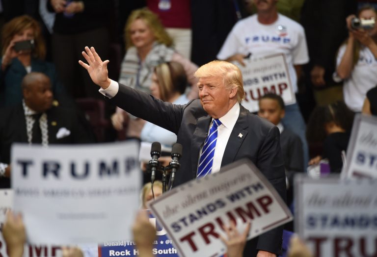 A man claiming to support Republican presidential candidate Donald Trump was removed from a town hall Monday after he called the GOP front-runner 