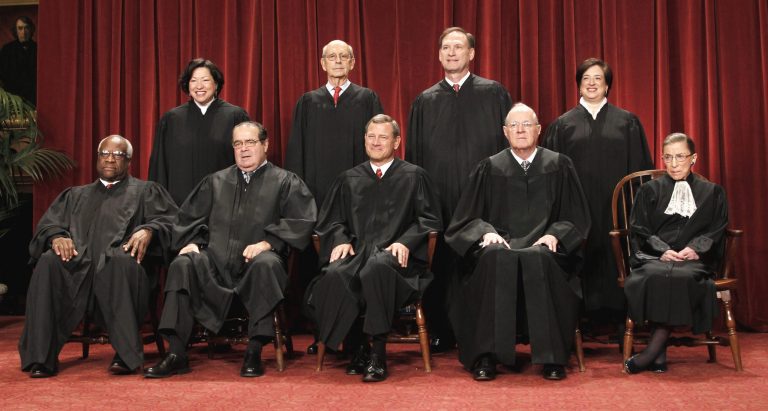 In this Oct. 8, 2010 file photo justices of the U.S. Supreme Court gather for a group portrait at the Supreme Court in Washington. Seated from left are Associate Justices Clarence Thomas, and Antonin Scalia, Chief Justice John Roberts, Associate Justices Anthony M. Kennedy, and Ruth Bader Ginsburg. Standing, from left are Associate Justices Sonia Sotomayor, Stephen Breyer, Samuel Alito Jr., and Elena Kagan. (AP Photo/Pablo Martinez Monsivais, File)