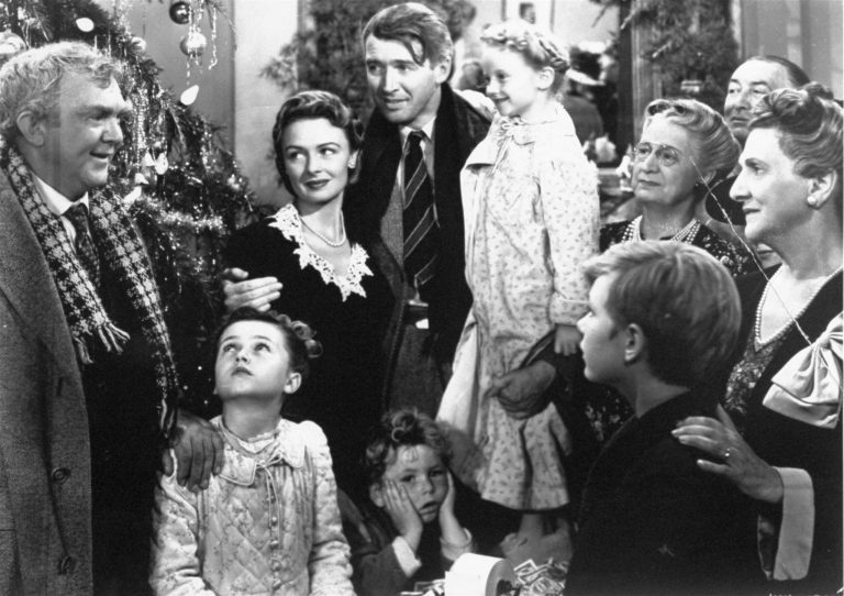James Stewart, center, is reunited with his wife, Donna Reed, left, and children during the last scene of Frank Capra's 