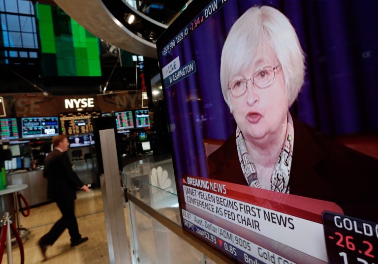 A television screen on the floor of the New York Stock Exchange shows Federal Reserve Chair Janet Yellen's first news conference, in Washington D.C., Wednesday, March 19, 2014.  The Federal Reserve is seeking to clarify when it might start to raise short-term interest rates from record lows. The Fed also says it will cut its monthly long-term bond purchases by another $10 billion to $55 billion because it thinks the economy is strong enough to support further improvements in the job market. (AP Photo/Richard Drew)
