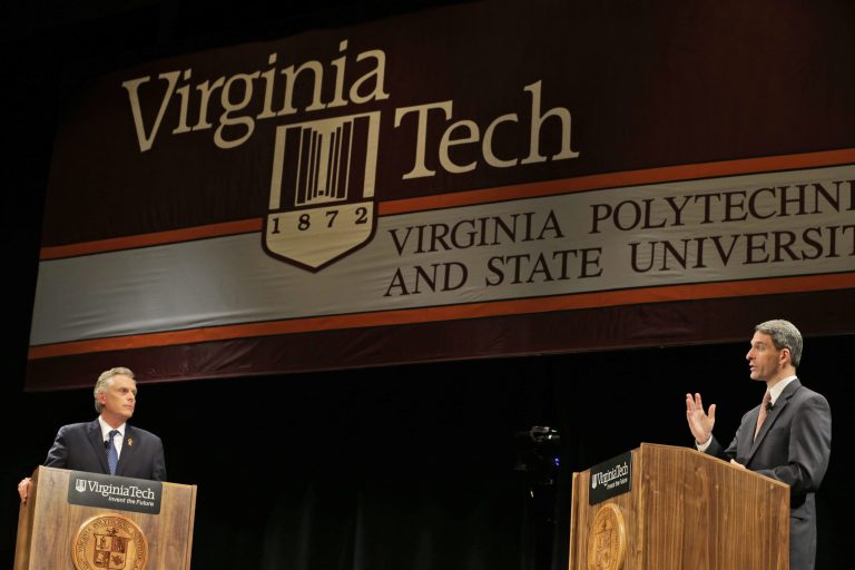 Democratic gubernatorial candidate, Terry McAuliffe, left, listens as Republican challenger Virginia Attorney General Ken Cuccinelli, right, gestures during a debate at Virginia Tech in Blacksburg, Va., Thursday. (AP Photo/Steve Helber)