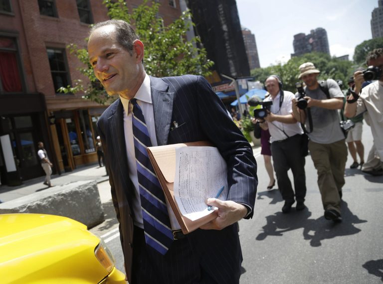 Former New York Gov. Eliot Spitzer walks to a cab after trying to collect signatures for his run for New York City comptroller in Union Square in New York on Monday. (AP/Seth Wenig)