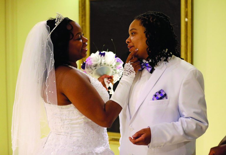 Darcia Anthony, left, and her partner, Danielle Williams, chat before participating in a marriage ceremony at City Hall in Baltimore, Tuesday, Jan. 1, 2013. Same-sex couples in Maryland are now legally permitted to marry under a new law that went into effect after midnight on Tuesday. Maryland is the first state south of the Mason-Dixon Line to approve same-sex marriage. (AP Photo/Patrick Semansky)