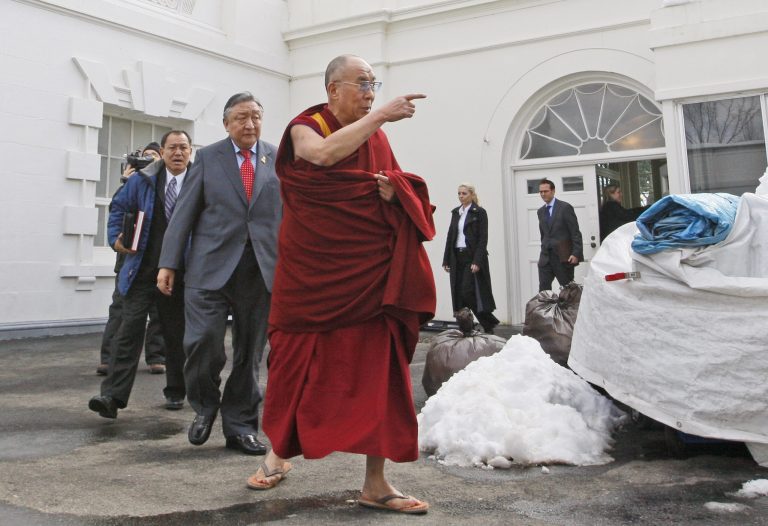 FILE - In this Feb. 18, 2010, file photo, The Dalai Lama walks out of the White House in Washington, after meeting with President Barack Obama. Obama will host Tibetan spiritual leader the Dalai Lama for a meeting on Feb. 21, 2014, the White House said, in a move that could rankle already tense relations between the U.S. and China. (AP Photo/Charles Dharapak, File)