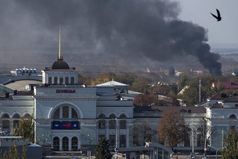 Smoke rises behind Donetsk train station, not far from the Donetsk Sergey Prokofiev International Airport, during an artillery battle between pro-Russian rebels and Ukrainian government forces in the town of Donetsk, eastern Ukraine, Sunday, Oct. 12, 2014. Donetsk airport is the focus of much of the fighting but has no immediate tactical significance for separatist forces who are devoid of any air power. (AP Photo/Dmitry Lovetsky)