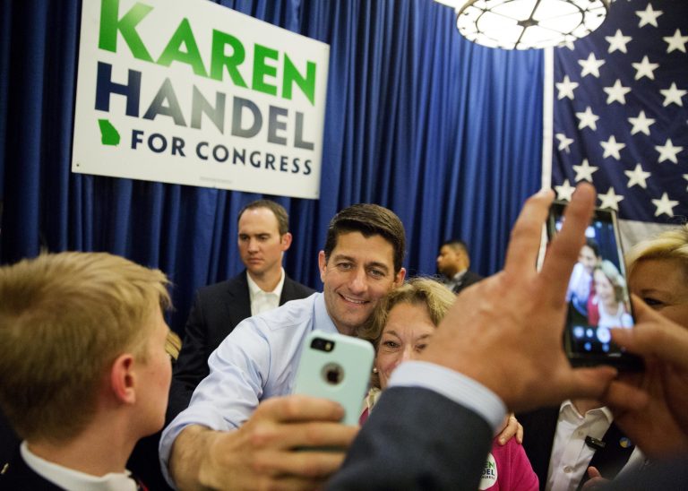 House Speaker Paul Ryan takes photos with members of the crowd after campaigning for Republican candidate for 6th congressional district Karen Handel at an event in Dunwoody, Ga., Monday, May 15, 2017. (AP Photo/David Goldman)