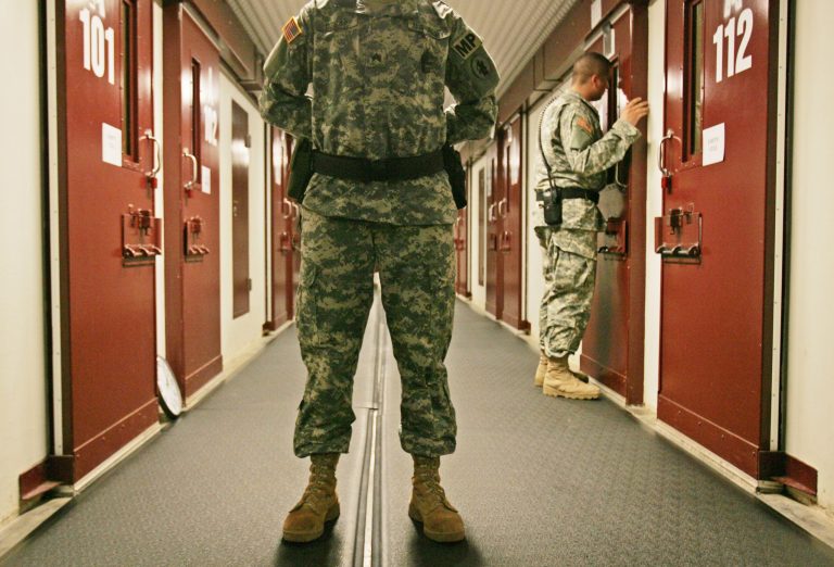Military personnel inspect each occupied cell on a two-minute cycle at Camp 5 maximum-security facility on the Guantanamo Bay Naval Base in Cuba. (AP Photo/Brennan Linsley, File)