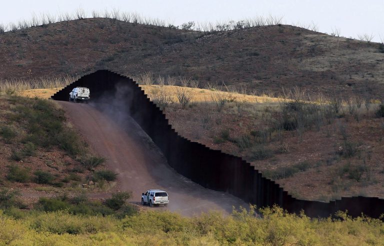 U.S. Border Patrol agents patrol the border fence near Naco, Ariz. (AP/Ross D. Franklin)
