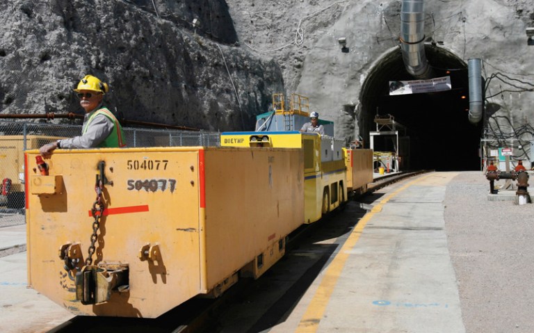Pete Vavricka conducts an underground train from the entrance of Yucca Mountain in Nevada. (AP Photo/Isaac Brekken)