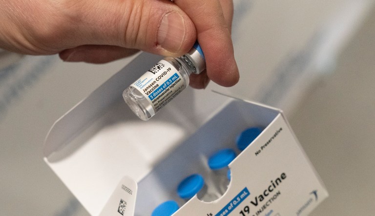FILE - In this Wednesday, March 3, 2021 file photo, a pharmacist holds a vial of the Johnson & Johnson COVID-19 vaccine at a hospital in Bay Shore, N.Y. Janssen Pharmaceuticals is a division of Johnson & Johnson.  (AP Photo/Mark Lennihan)