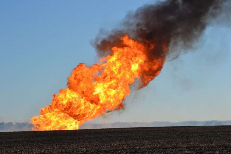 Flames leap into the air from a natural gas pipeline fire on March 14 north of Fremont, Neb. (AP Photo/The Tribune, Chris Zavadil)