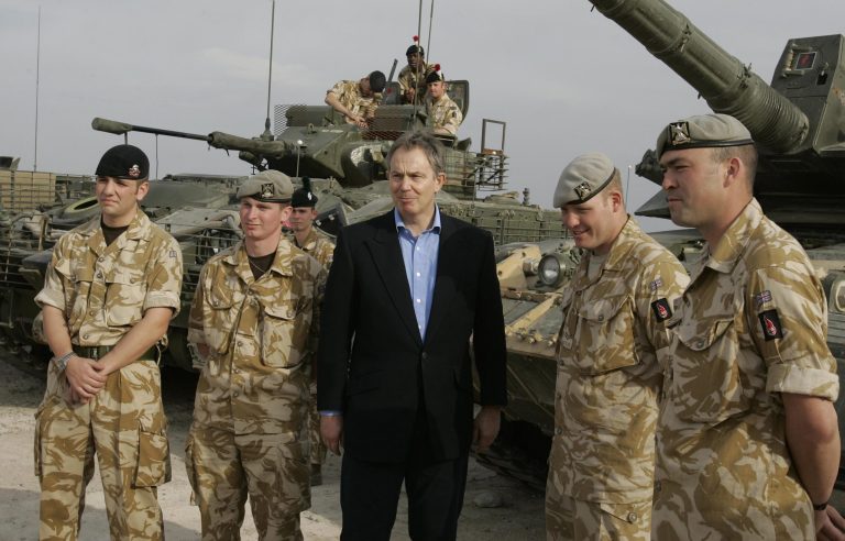 The then-Britain's Prime Minister Tony Blair meets soldiers at Shaibah logistics base, Basra, Iraq. Thirteen years after British troops marched into Iraq and seven years after they left a country that's still mired in violence, a mammoth official report addresses the lingering question: What went wrong? (AP Photo/Kirsty Wigglesworth, File)