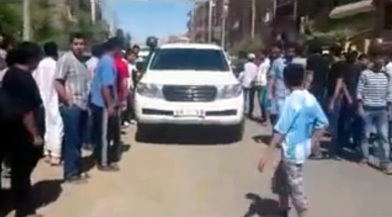  This image made from amateur video released by Shaam News Network and accessed Tuesday, June 12, 2012 purports to show a UN observer vehicle surrounded by civilians in Deir el-Zour, Syria.(AP Photo/Shaam News Network via AP video)THE ASSOCIATED PRESS CANNOT INDEPENDENTLY VERIFY THE CONTENT, DATE, LOCATION OR AUTHENTICITY OF THIS MATERIAL  
