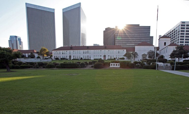FILE - This Nov. 8, 2011 file photo shows the vast lawn in front of Beverly Hills High School. Tentative plans call for drilling a subway tunnel 70 feet beneath the campus. Los Angeles' growing public transit network is receiving another big dose of cash from the federal government. Federal and local transportation officials are set to sign grant and loan agreements Wednesday, May 21, 2014, totaling $2.1 billion, so that the L.A. County Metropolitan Transportation Authority can extend a subway line into Beverly Hills and, if several lawsuits are settled, all the way to the west side. One of the lawsuits concerns the subway's routing near the high school. (AP Photo/Reed Saxon, File)