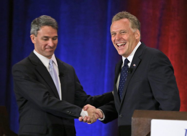 Republican gubernatorial candidate Ken Cuccinelli, left, greets Democratic challenger Terry McCauliffe at the start of the Virginia Bar Association convention debate at the Homestead in Hot Springs, Va. Saturday, July 20. (AP/Steve Helber)